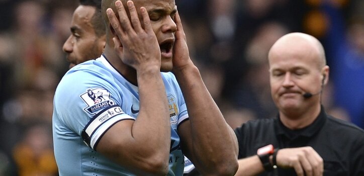 Manchester City's Vincent Kompany reacts after being sent off by referee Lee Mason during their English Premier League soccer match against Hull City in Hull